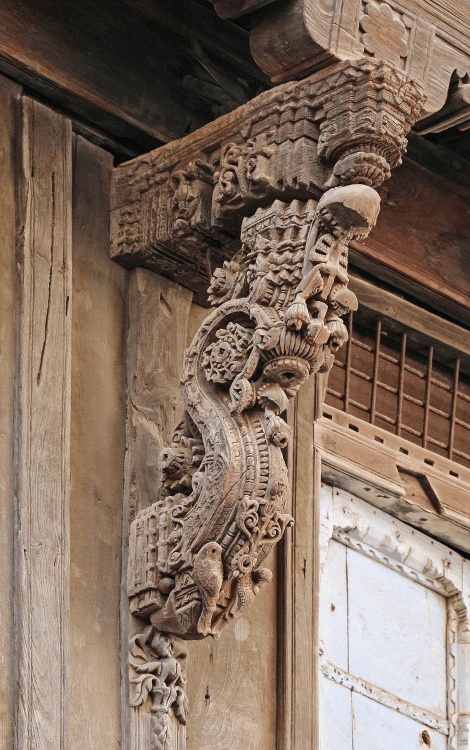 Carved timber brackets and balcony details in Ahmedabad